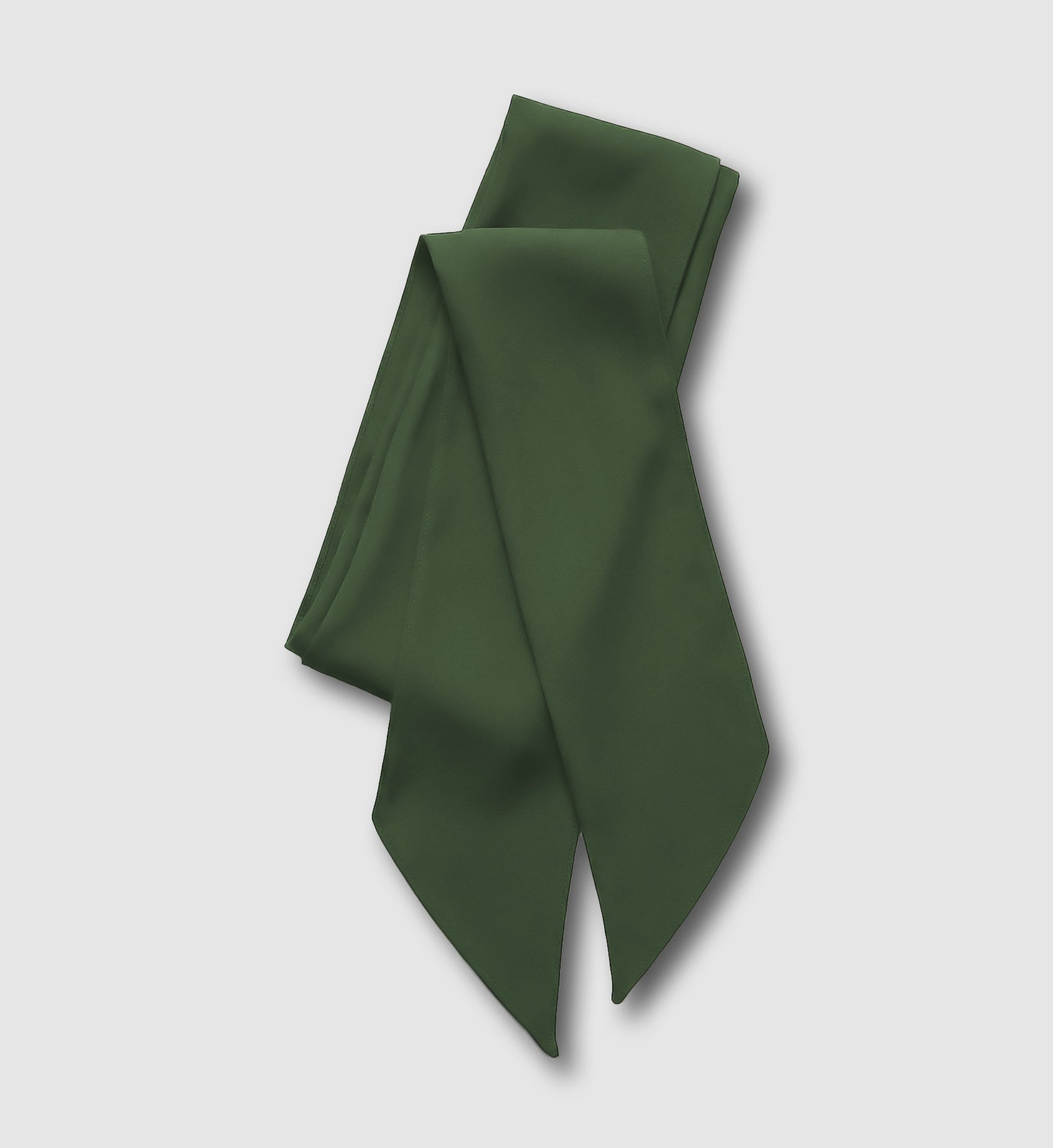 Green silk scarf on a light gray background