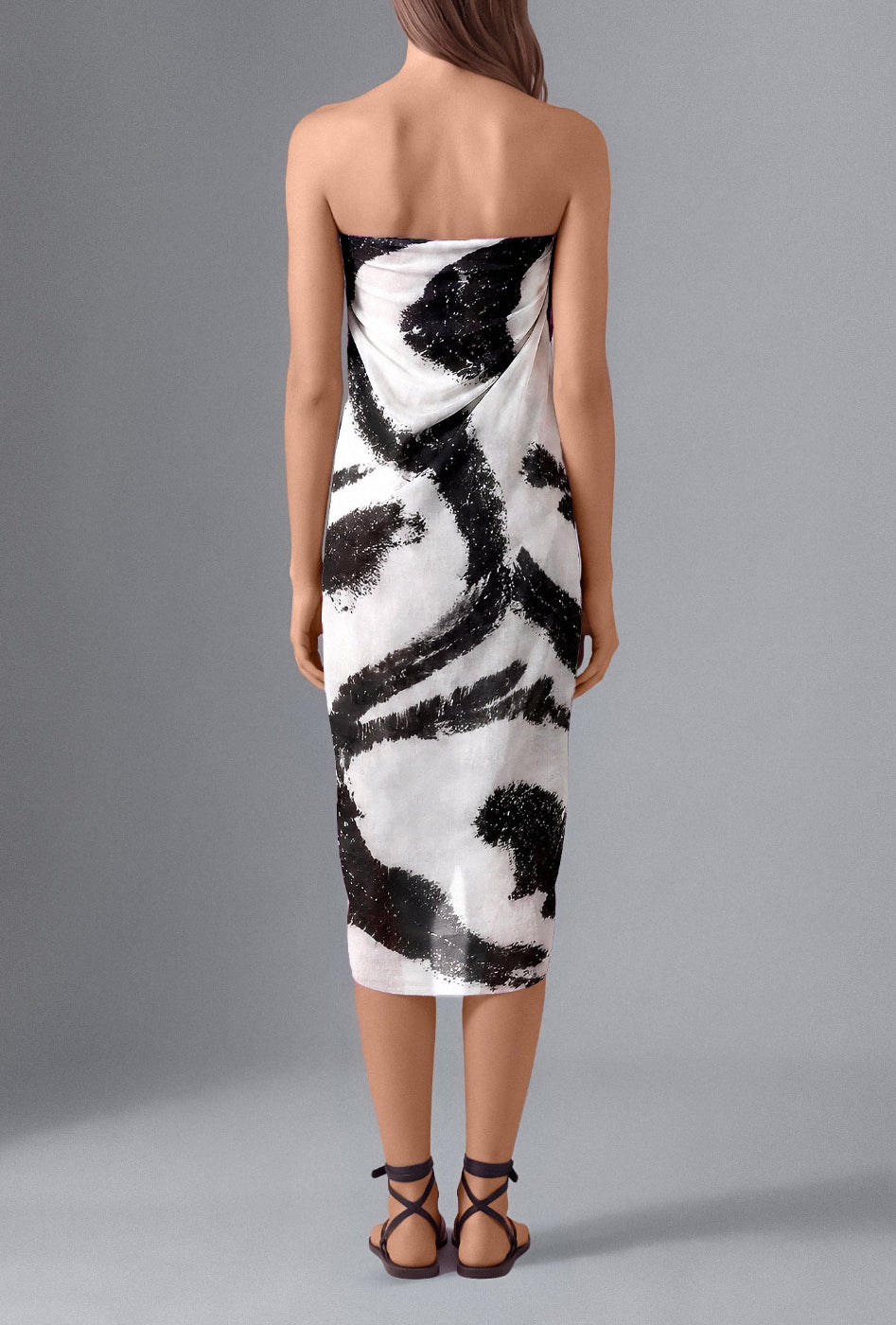 Butterfly Pareo in Black & White worn as a strapless beach wrap – back view