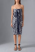 Model wearing the Isabella Kron Graffito Pareo in Blue & White, crafted in Italy from lightweight cotton voile and styled as an elegant strapless resort cover-up.