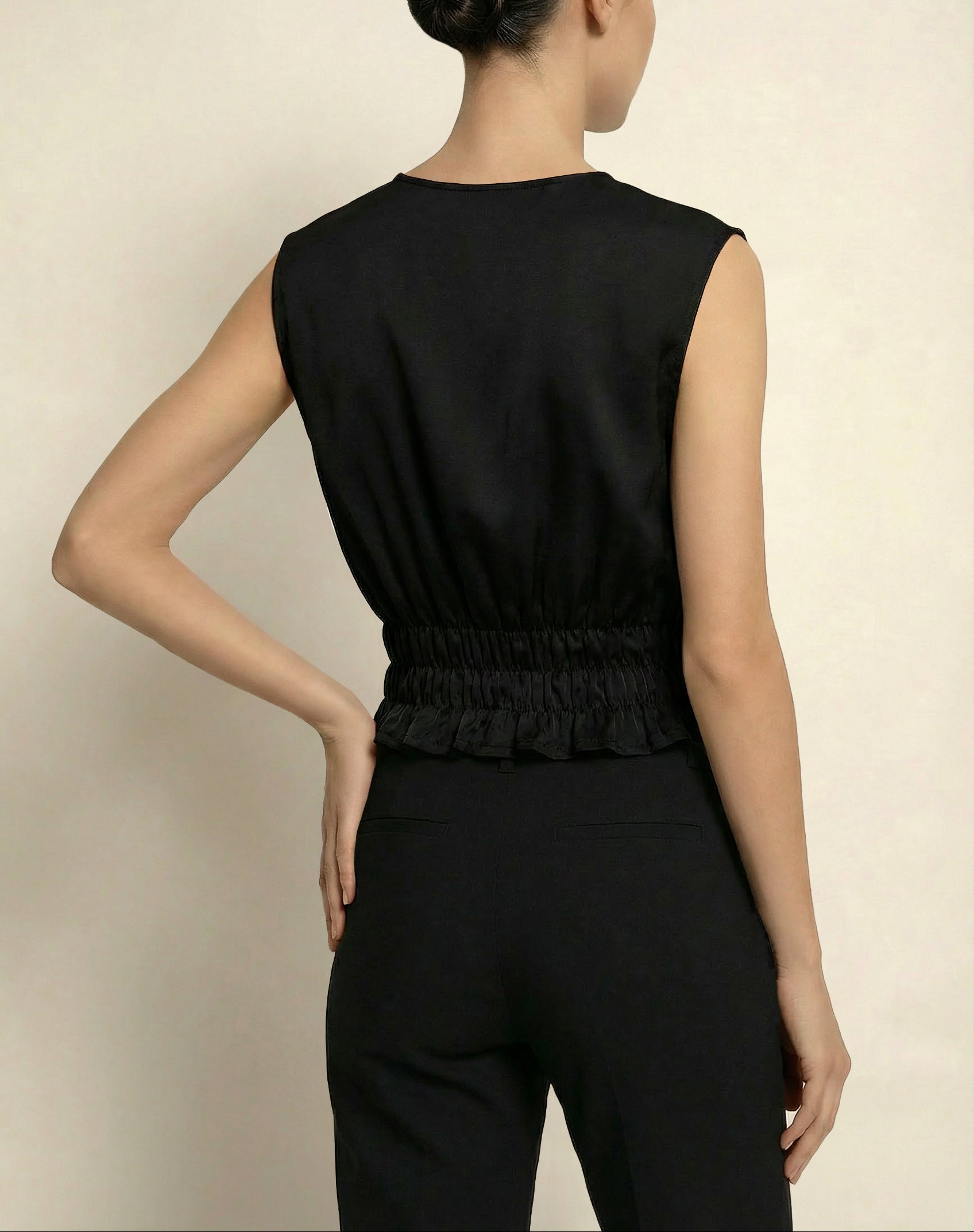 Model wearing black Holborn Top by Isabella Kron – back view