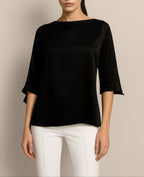 Model wearing Isabella Kron’s black Janis Top