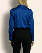 Back view of Isabella Kron Linda Shirt in bluette, highlighting central back pleat and clean seams