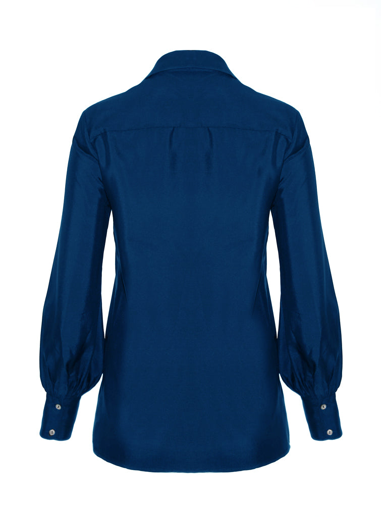 Back view of Isabella Kron Linda Shirt in bluette, highlighting central back pleat and clean seams