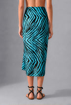 Back view of turquoise and black Savana Pareo with fluid drape and graphic resort print