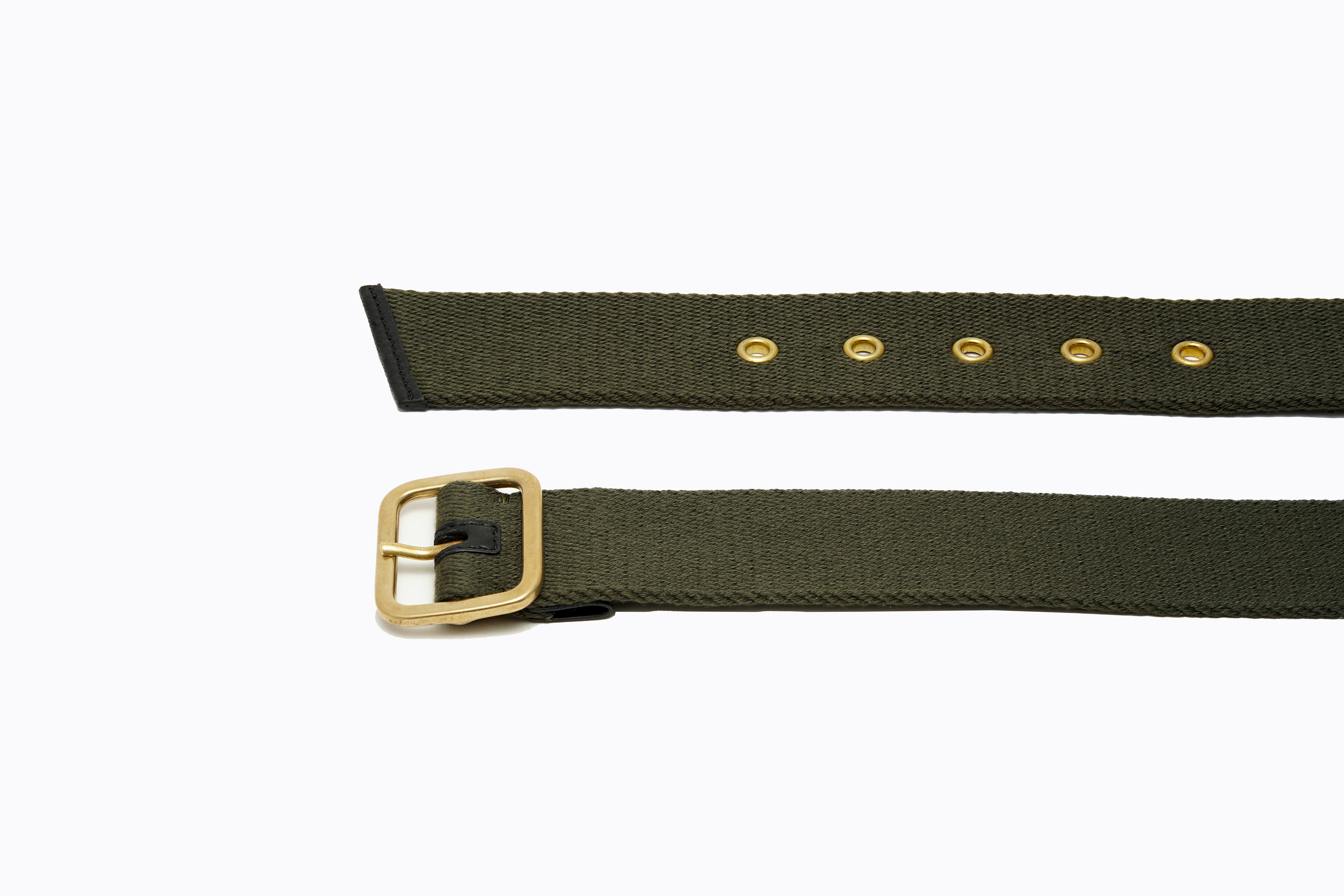 Close-up of brass buckle, eyelets and leather-trimmed edge on Isabella Kron Blix Belt in military green