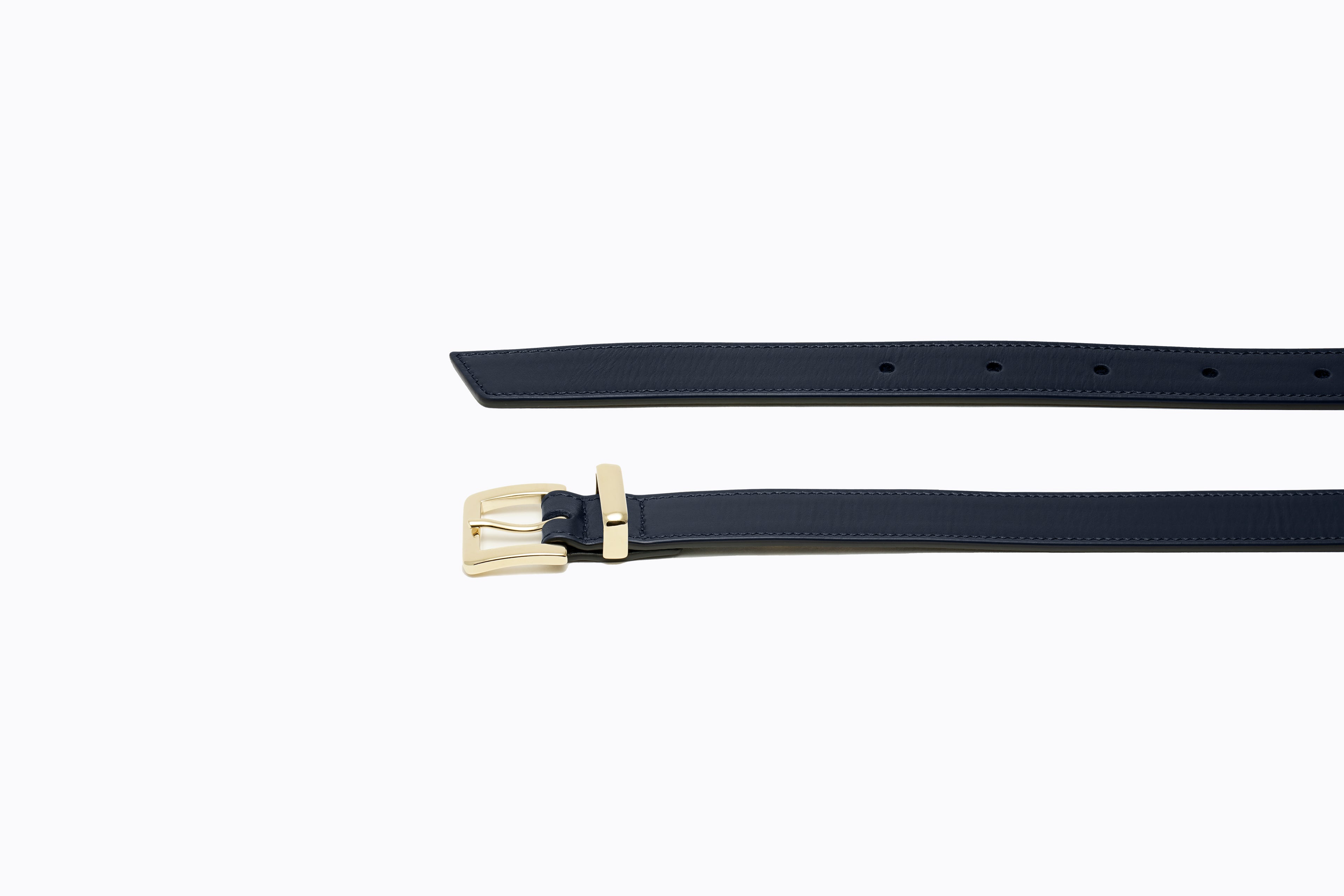 Side angle view of Brylee Belt in blue leather, highlighting belt thickness and gold buckle profile
