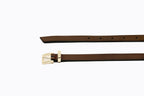 Close-up of polished gold buckle and fine-grain toffee leather on Isabella Kron Brylee Belt, showcasing craftsmanship