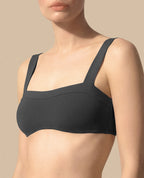 Isabella Kron Dori bikini bandeau graphite Italian luxury swimwear minimalist silhouette close up
