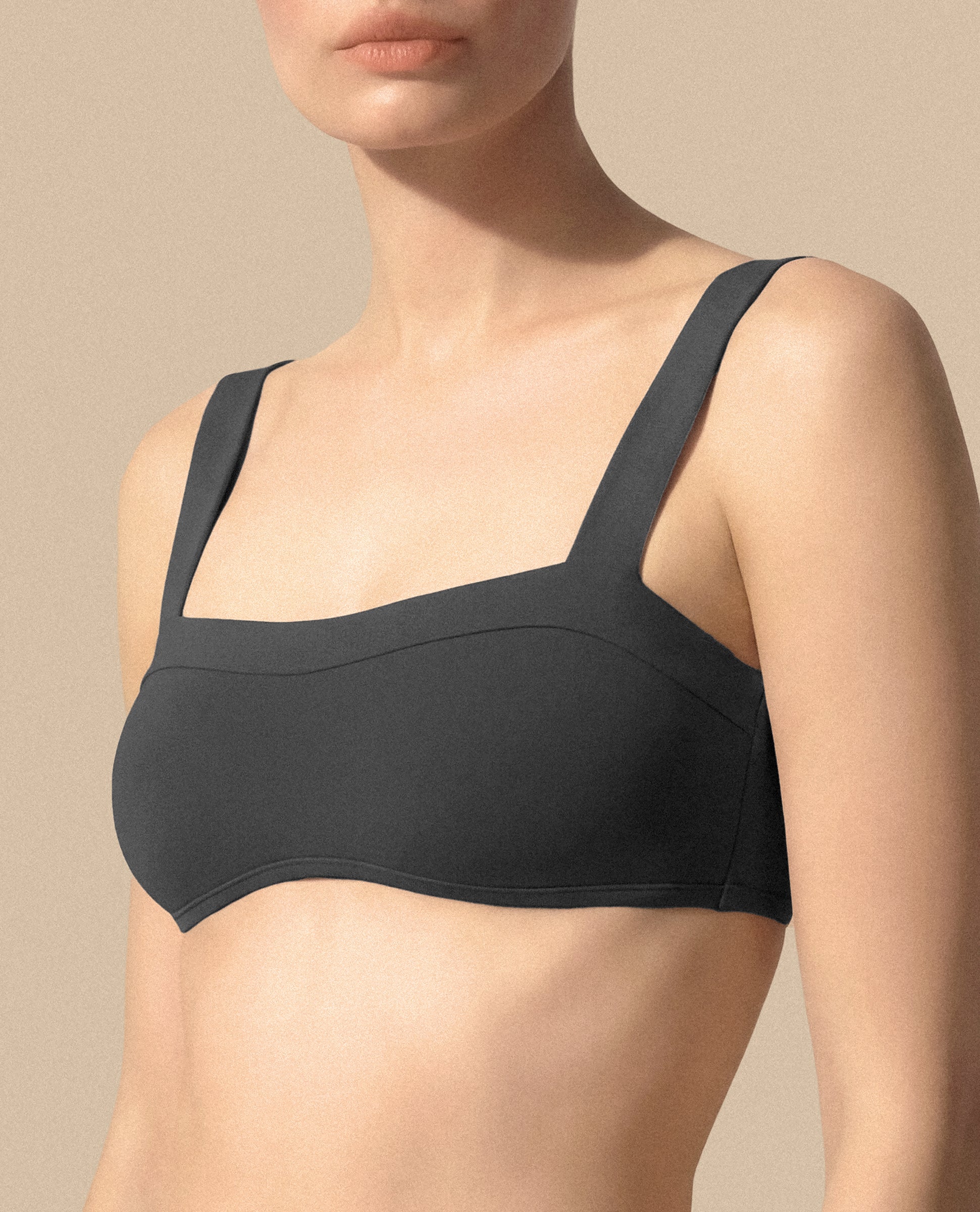 Isabella Kron Dori bikini bandeau graphite Italian luxury swimwear minimalist silhouette close up