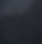 Close-up of Ibbie Bag in black canvas – fine texture, contrast stitching, and elegant hardware details