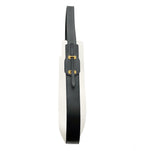 Side view of Ibbie Bag in white canvas – structured silhouette with premium leather trim and gold accents