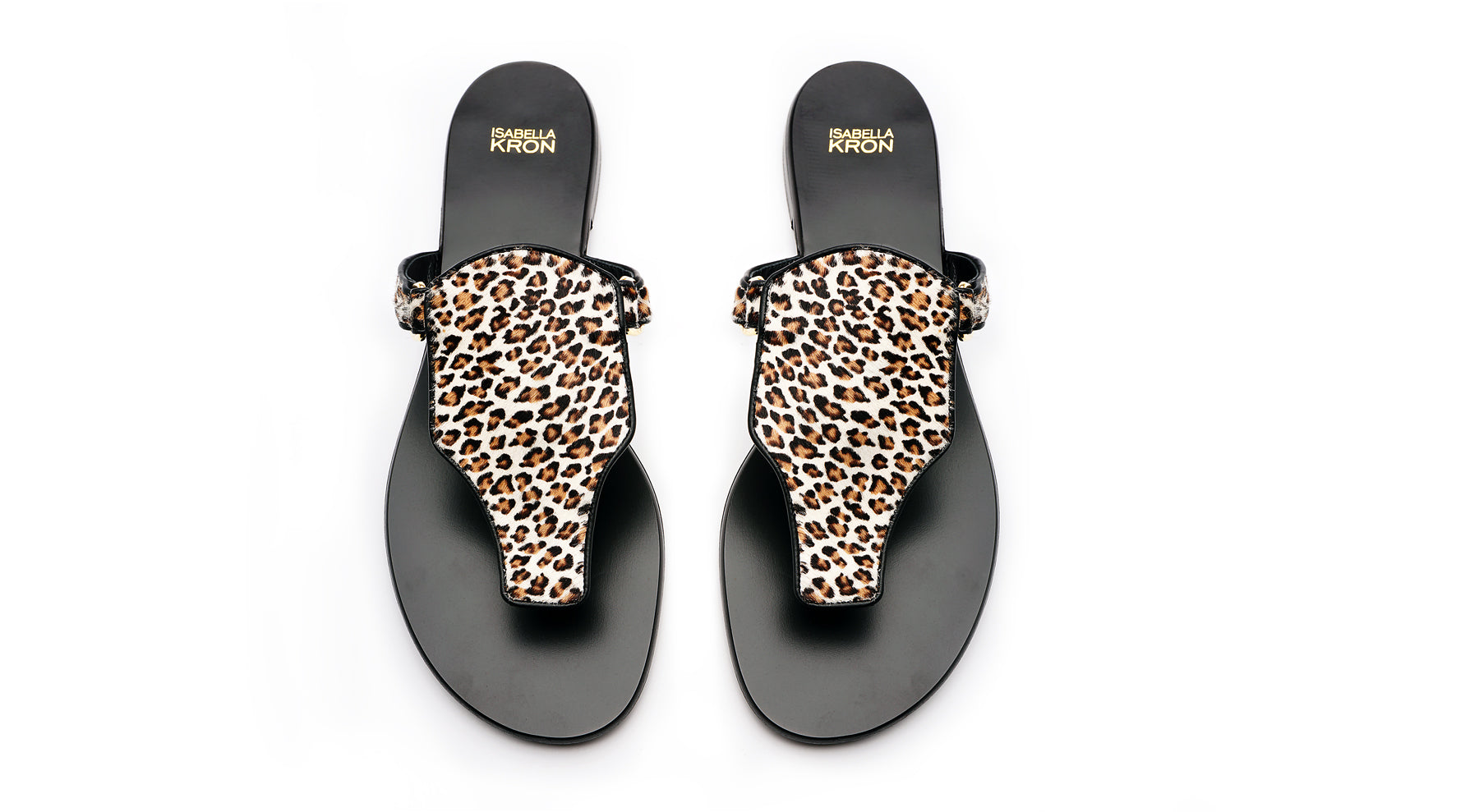 Profile view of Ilka Mini Sandal – brown suede base with leopard-print haircalf strap, minimalist silhouette