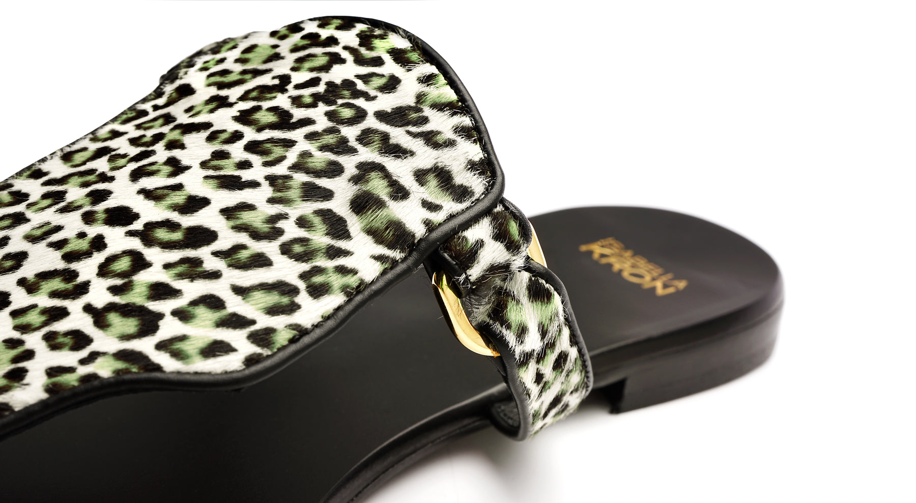 Close-up of Ilka Mini Sandal – luxurious haircalf texture and hardware details in military tones