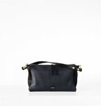 Isabella Kron Isotta Convertible in blue, showing slim profile, detachable crossbody strap, and smooth leather finish