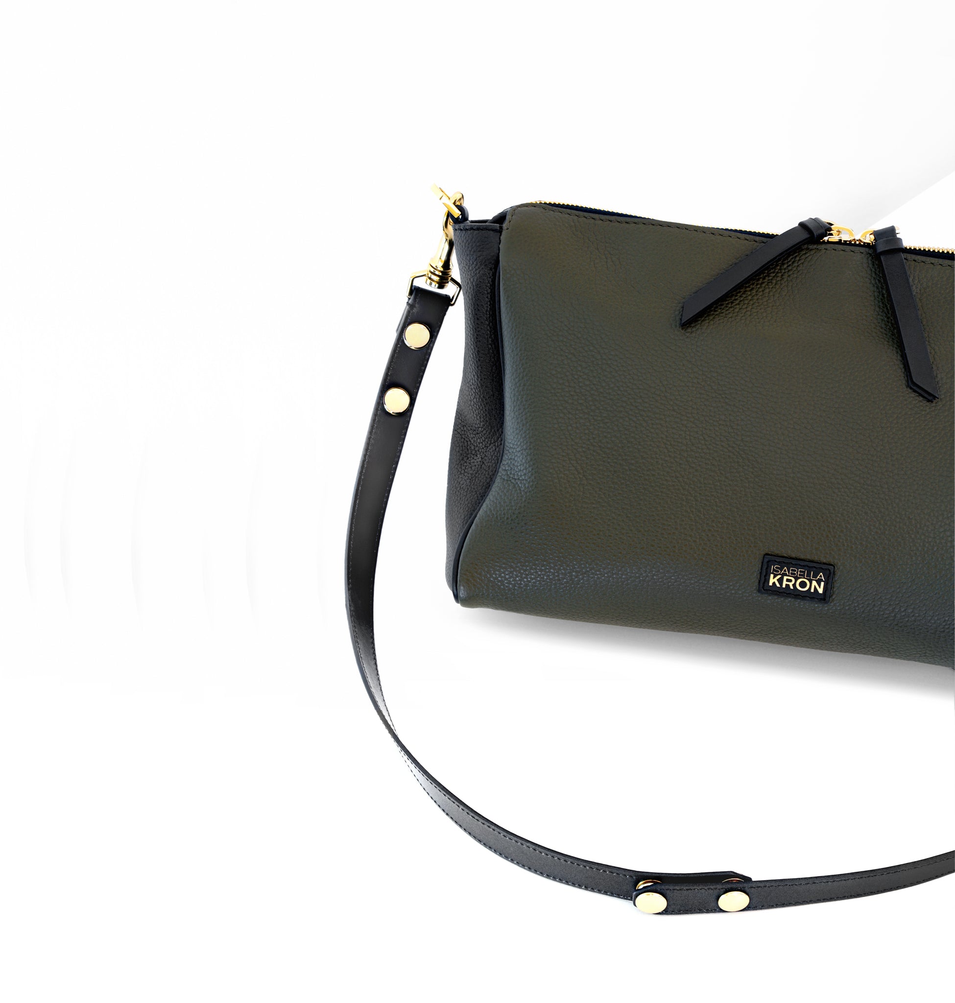 Close-up of polished silver hardware, detachable strap clip, and rich leather texture on Isabella Kron Isotta Convertible in military green