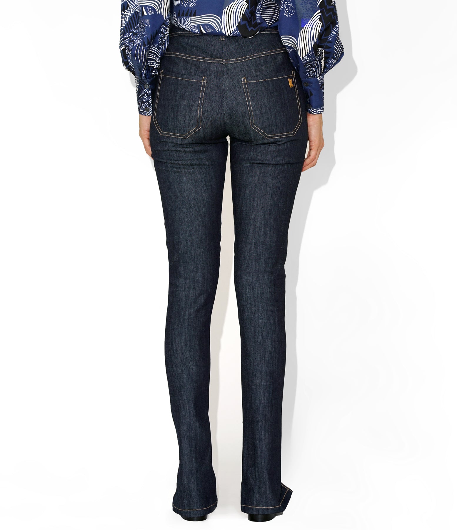 Back view of Isabella Kron K‑22 Jean in dark indigo, highlighting back pockets, yoke seam, and clean tailored finish
