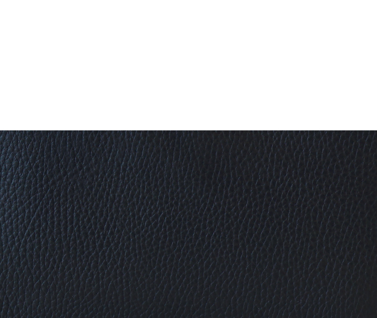 Detail of K Clutch Blue – close-up of fine grain Italian leather and impeccable stitching