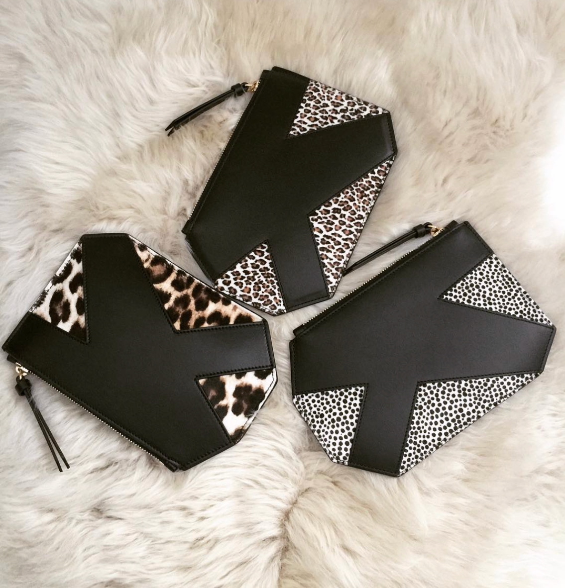 Alternate angle of K Clutch in Black Suede – refined clutch with modern, versatile silhouette