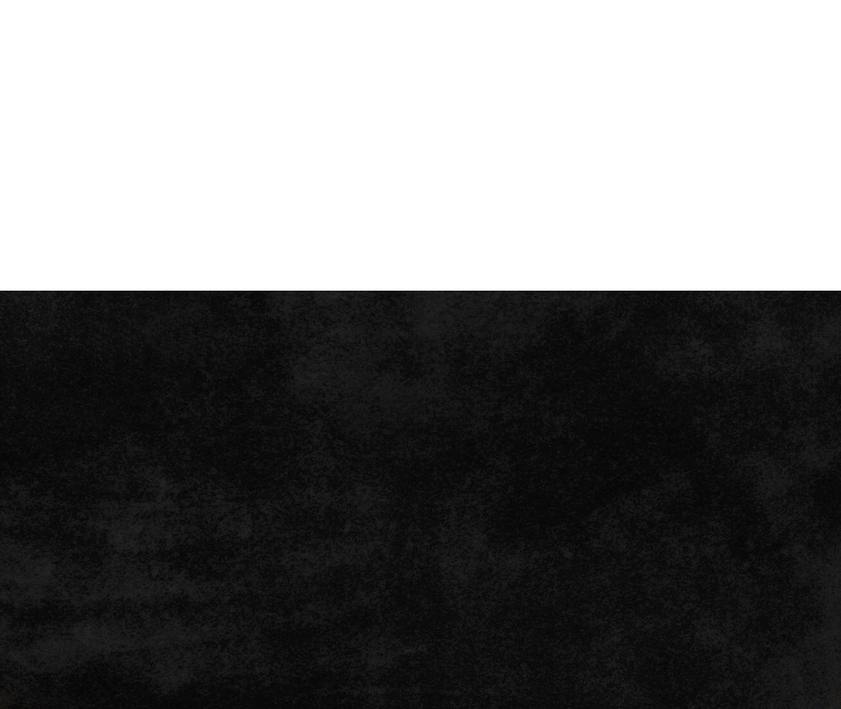 Detail of K Clutch in Black Suede – close-up of rich suede texture and fine Italian craftsmanship