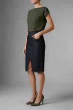 Full-body model view wearing Isabella Kron Kate Skirt in denim, styled with tucked-in t-shirt to highlight casual A-line fit and clean silhouette