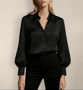Front view of Isabella Kron Linda silk shirt in black, luxurious button-down with relaxed fit and sheen silk drape