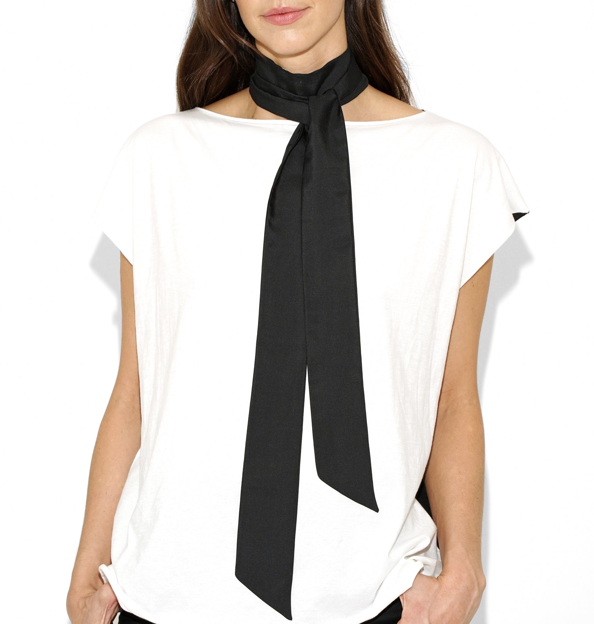 Close-up of Isabella Kron Nina silk scarf in black, showing fine silk weave, stitched edge, and subtle luster