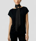 Front view of Isabella Kron Nina silk scarf in black, draped loosely around the neck showing smooth silk sheen and long rectangular shape