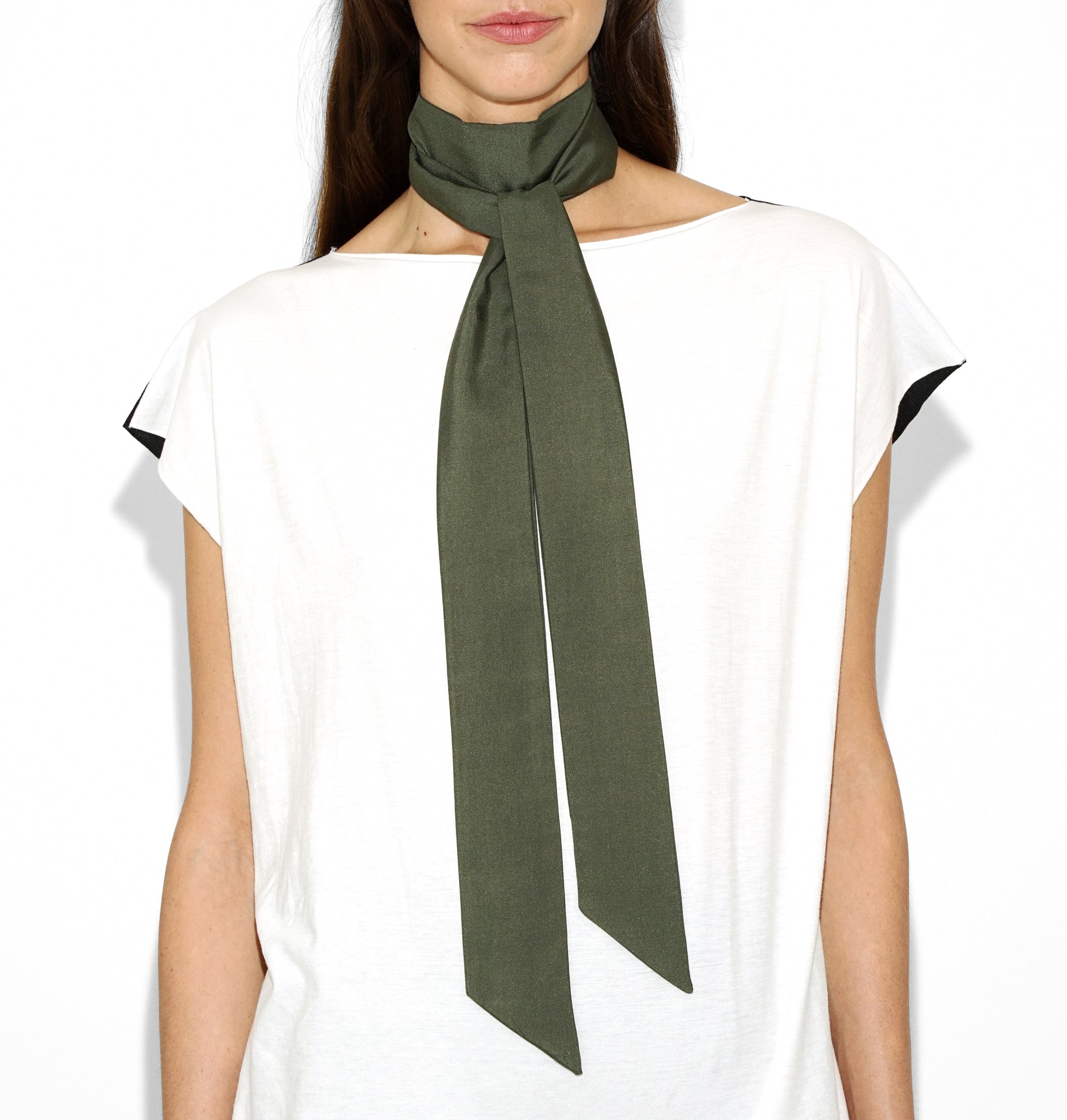 Close-up of Isabella Kron Nina silk scarf in military green, showing fine silk weave, stitched edge, and soft luster
