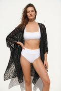 Front view of Isabella Kron Nomad Cover‑Up in black, relaxed open-front linen kimono with wide sleeves