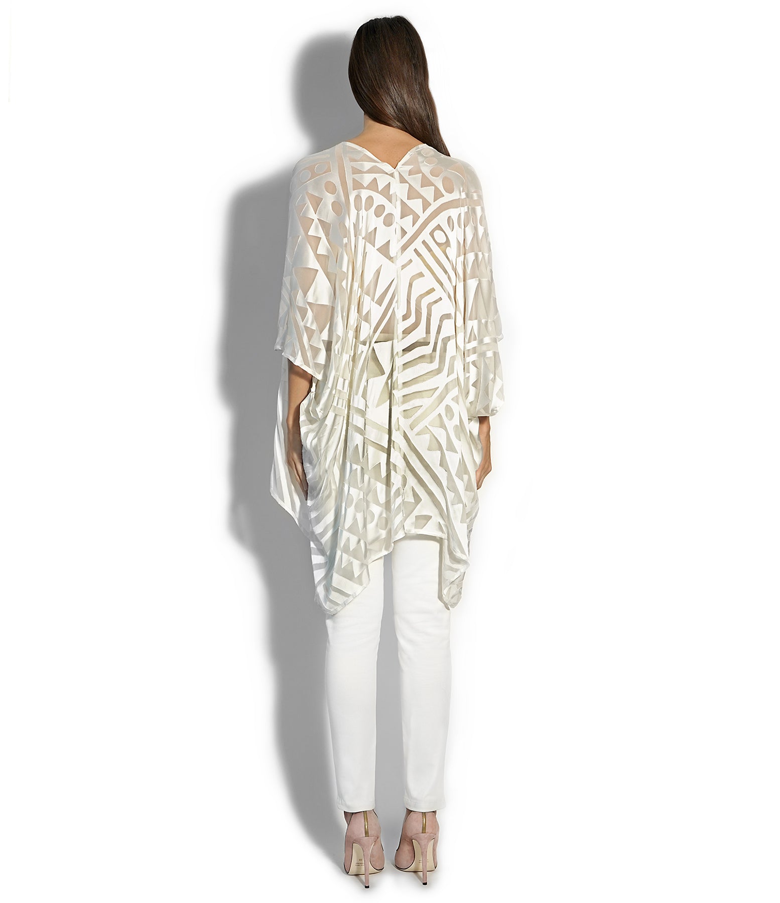 Back view of Isabella Kron Nomad Cover‑Up in ivory, showcasing straight back seam and relaxed fit over swimsuit or daywear