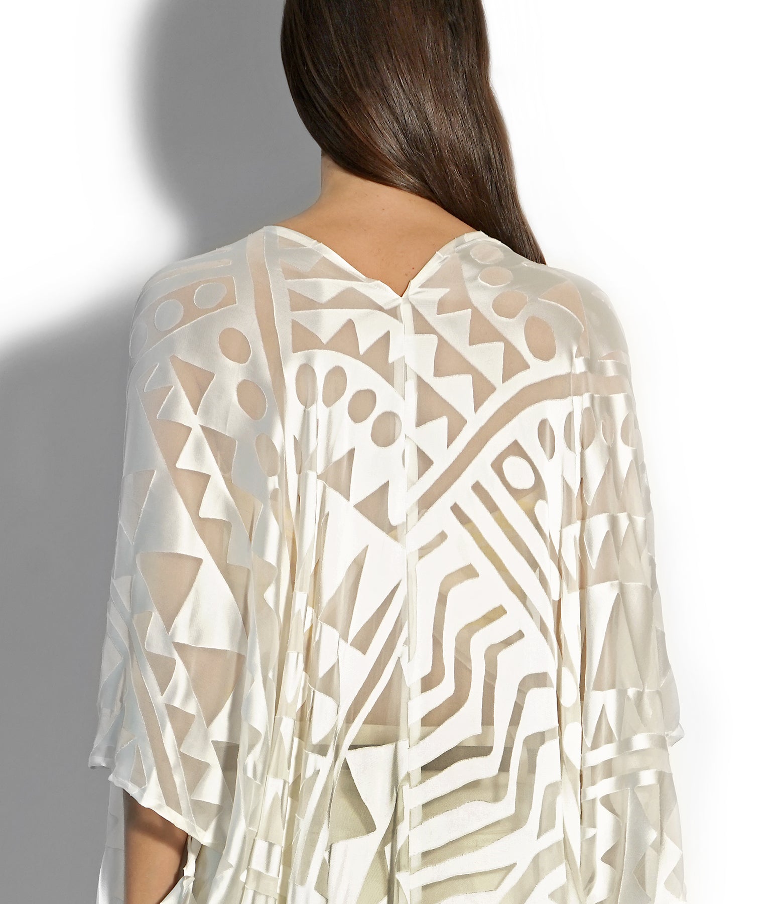 Close-up detail of ivory linen weave and clean hem finish on Isabella Kron Nomad Cover‑Up