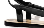 Detail of Patti Sandal in nappa black – supple leather straps and refined silhouette with artisan finish