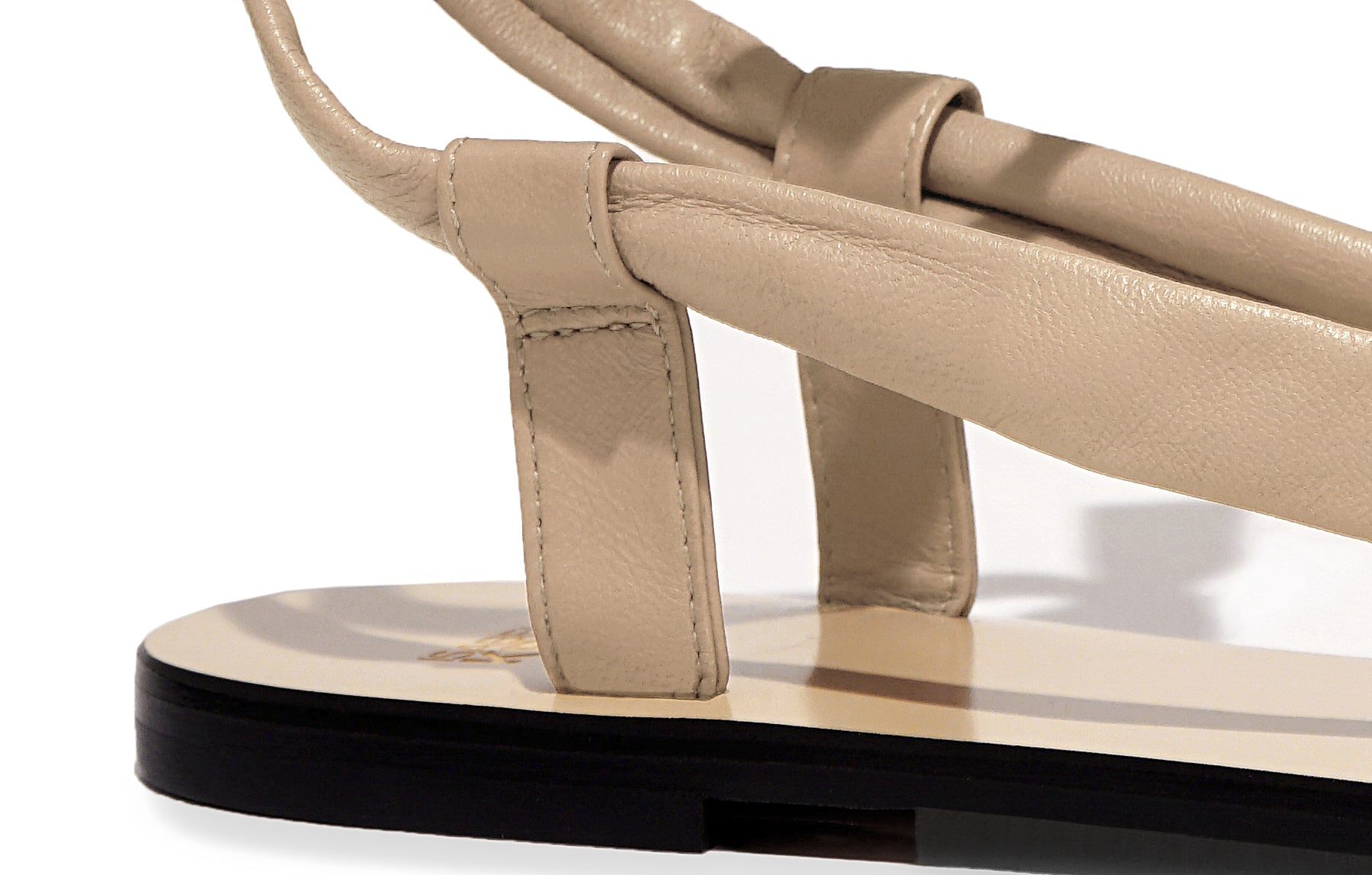 Detail of Patti Sandal in nappa nude – close-up of delicate straps and refined Italian craftsmanship