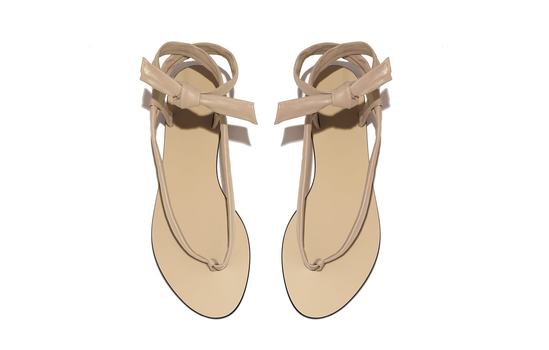 Overhead view of Patti Sandal in nude – elegant and minimal flat sandal in buttery Italian leather