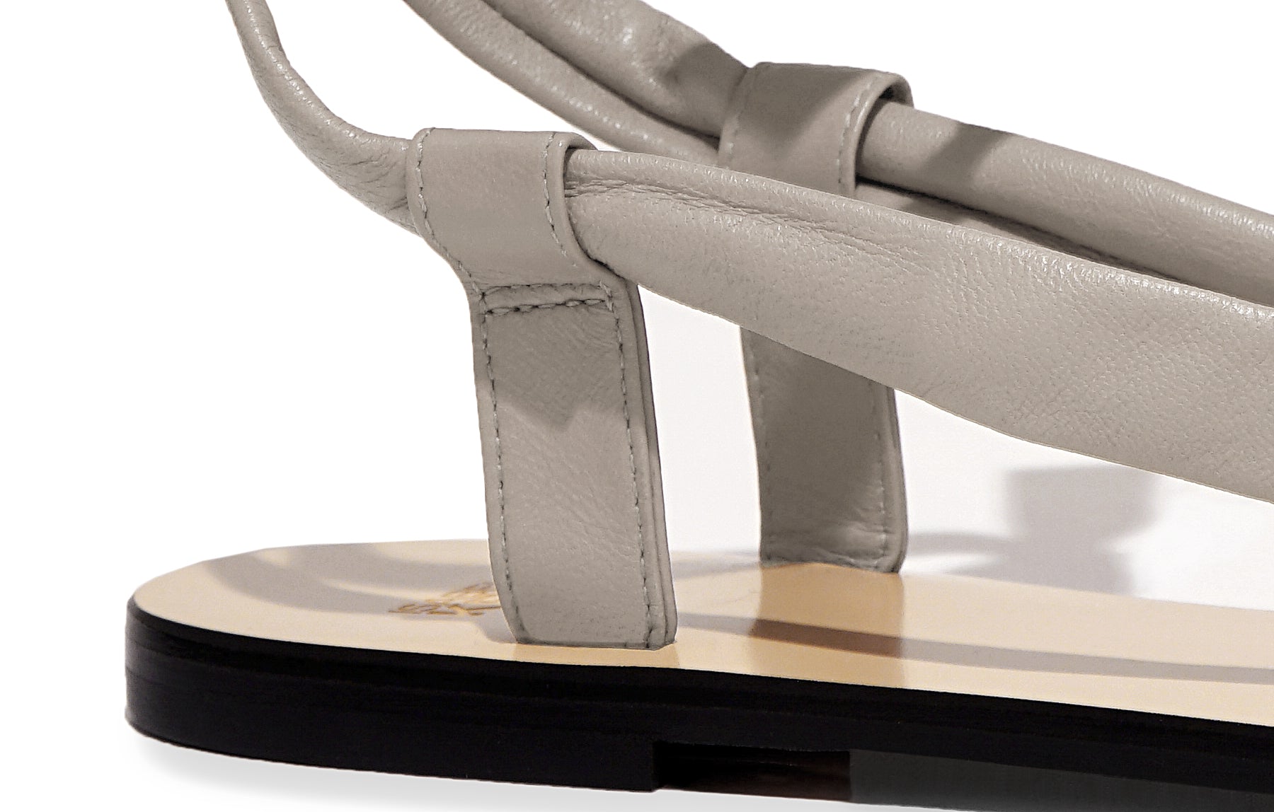 Detail of Patti Sandal in nappa scoglio – supple leather straps with sleek silhouette and artisan finish