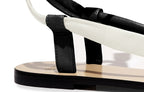 Detail of Patti Sandal in tapioca and nero – soft nappa leather, refined craftsmanship, and slim silhouette