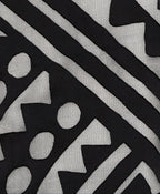 Close-up of black Rudi Tee fabric texture and stitching around crew neckline on Isabella Kron Rudi Tee