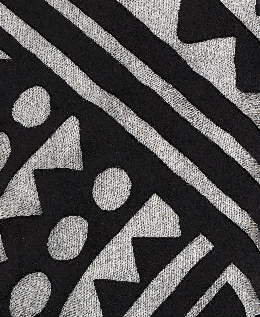 Close-up of black Rudi Tee fabric texture and stitching around crew neckline on Isabella Kron Rudi Tee