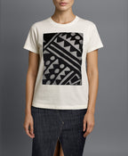 Full‑body model wearing Isabella Kron Rudi Tee, styled with  skirt to show relaxed fit and versatile layering