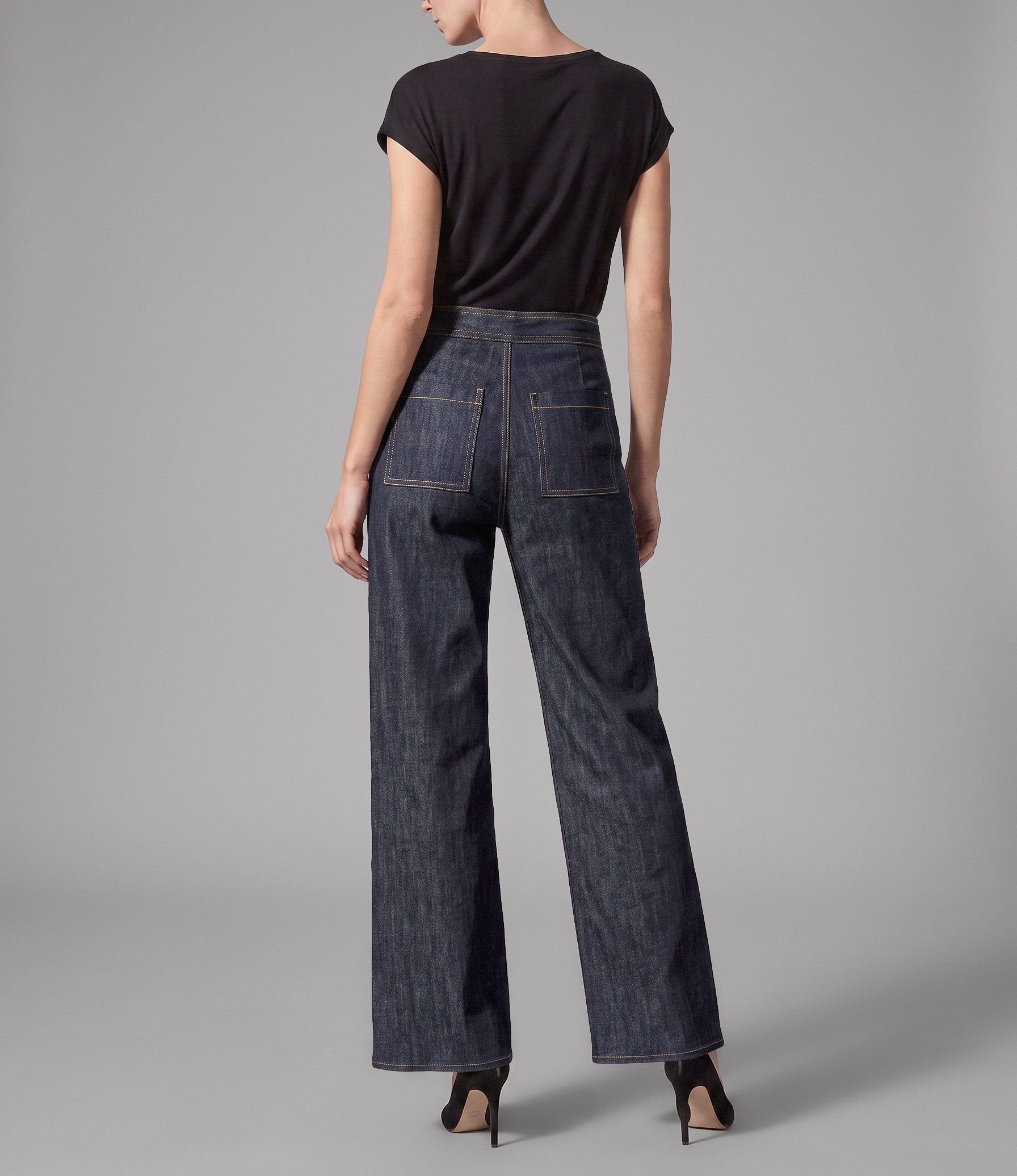 Model wearing the Isabella Kron Soho wide-leg denim pant in washed indigo