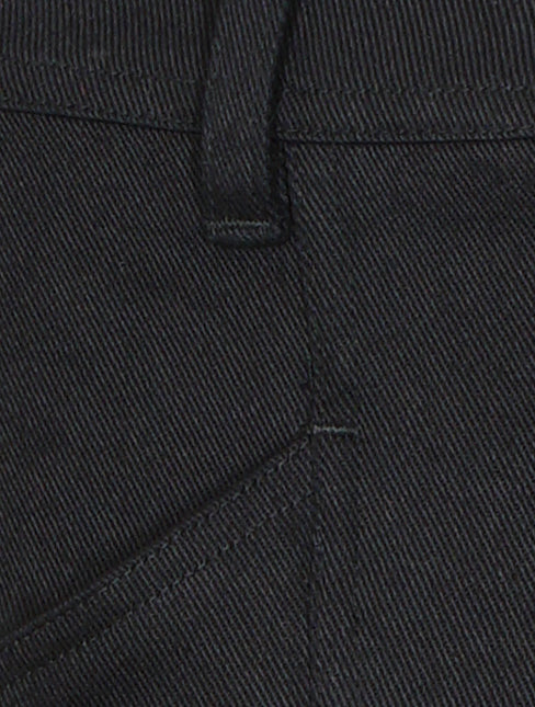 Close-up of ankle split and hem detail on Valentina Pant in black, featuring tailored stitching and stretch-cotton texture
